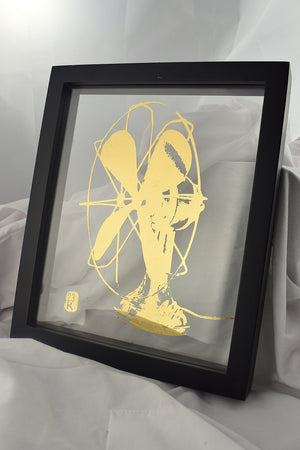 black floating frame with glass gilded with image of bauhaus fan