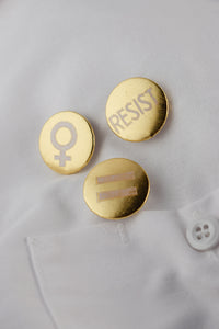 Three gold protest buttons 